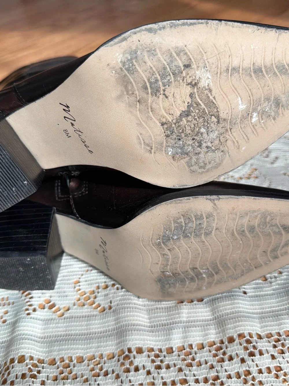 Brown leather boots with a pointed toe